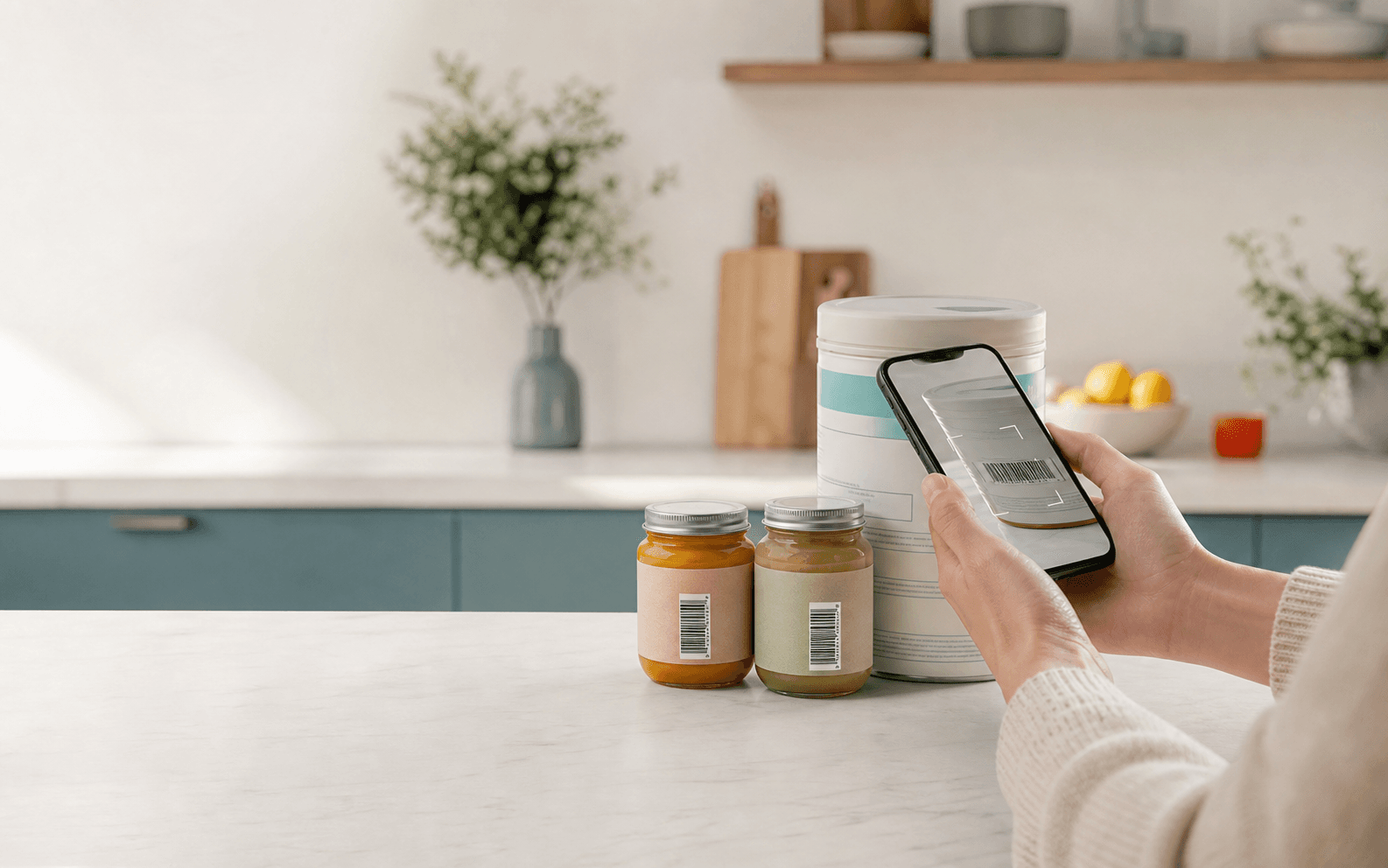 Phone scanning baby food packaging on a kitchen counter